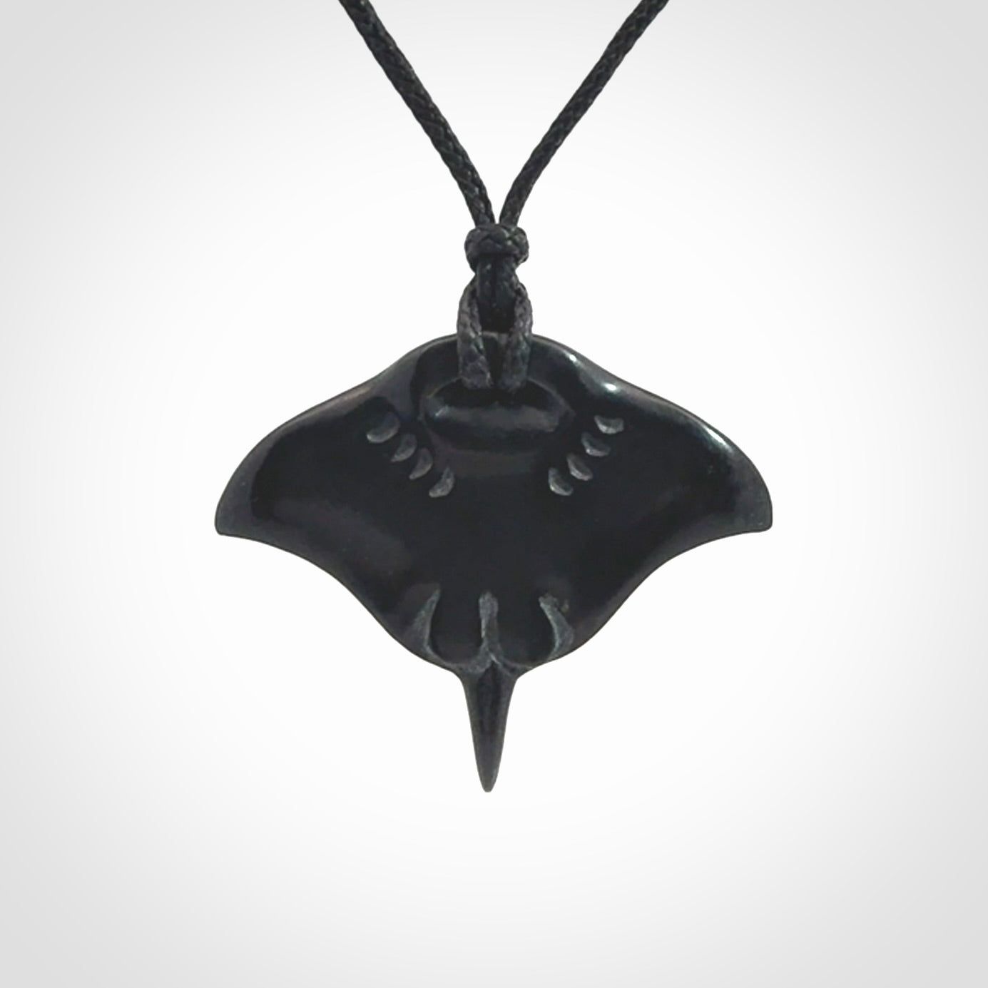 Hand carved manta ray pendant. Black jade manta pendant hand carved by NZ Pacific. Black jade jewellery for sale online.