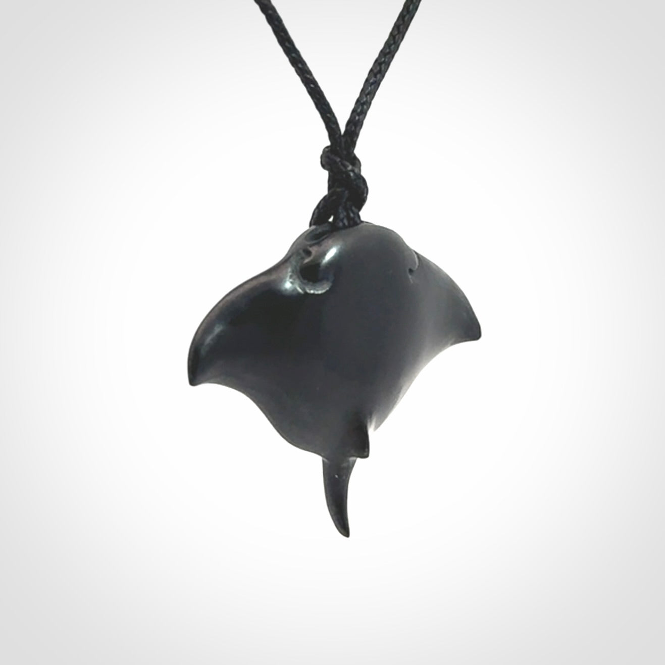Hand carved manta ray pendant. Black jade manta pendant hand carved by NZ Pacific. Black jade jewellery for sale online.