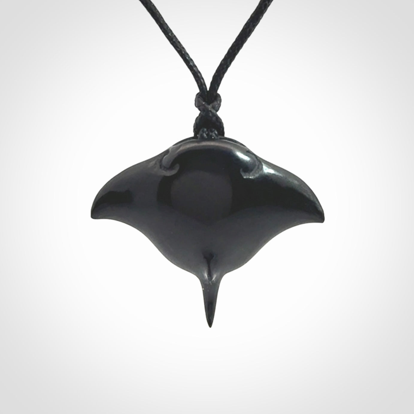 Hand carved manta ray pendant. Black jade manta pendant hand carved by NZ Pacific. Black jade jewellery for sale online.