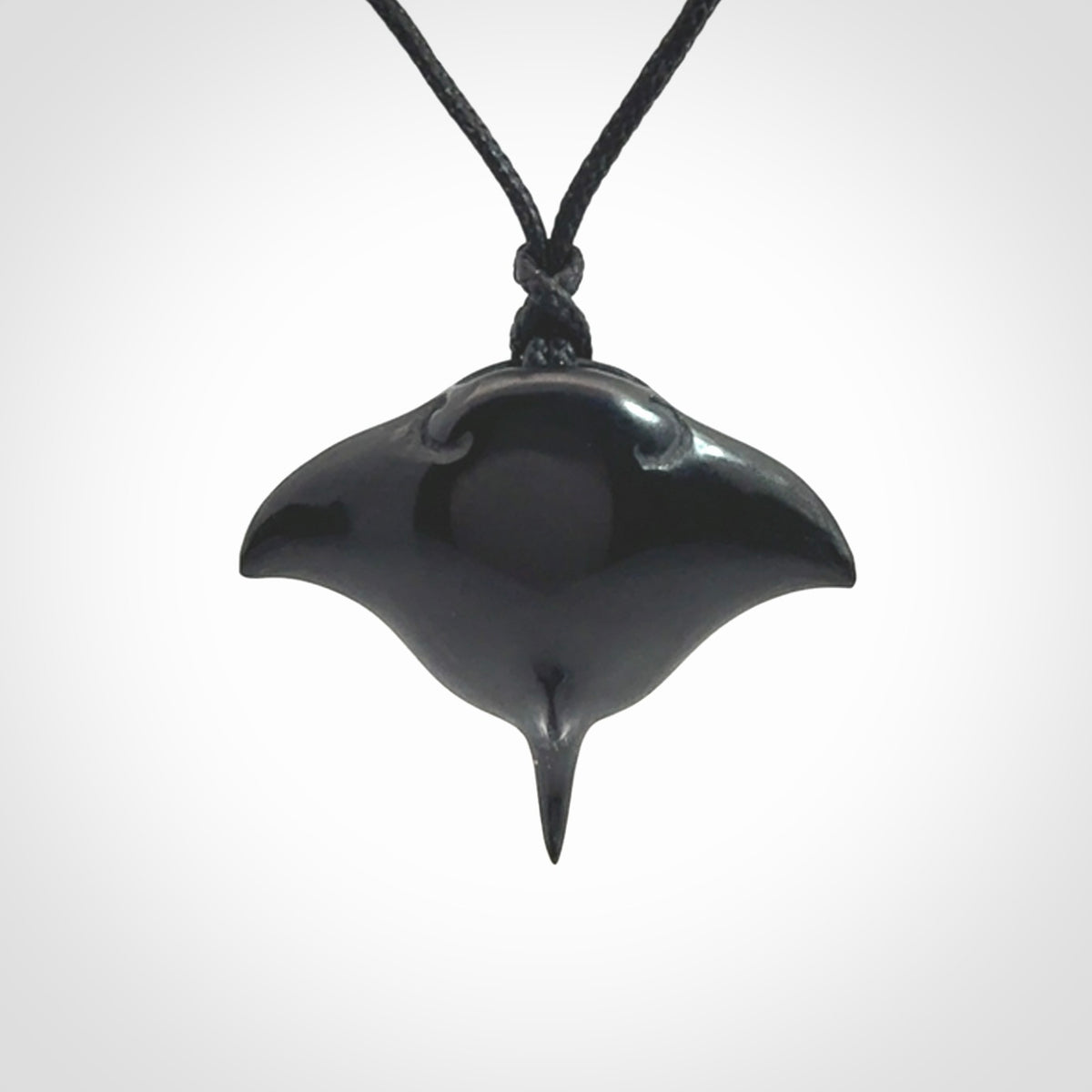 Hand carved manta ray pendant. Black jade manta pendant hand carved by NZ Pacific. Black jade jewellery for sale online.