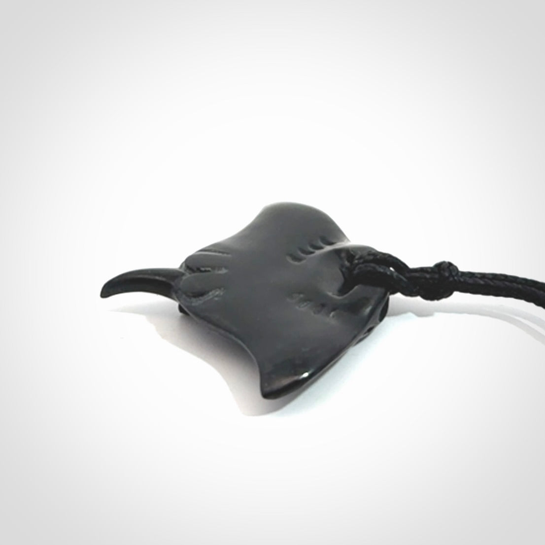 Hand carved manta ray pendant. Black jade manta pendant hand carved by NZ Pacific. Black jade jewellery for sale online.