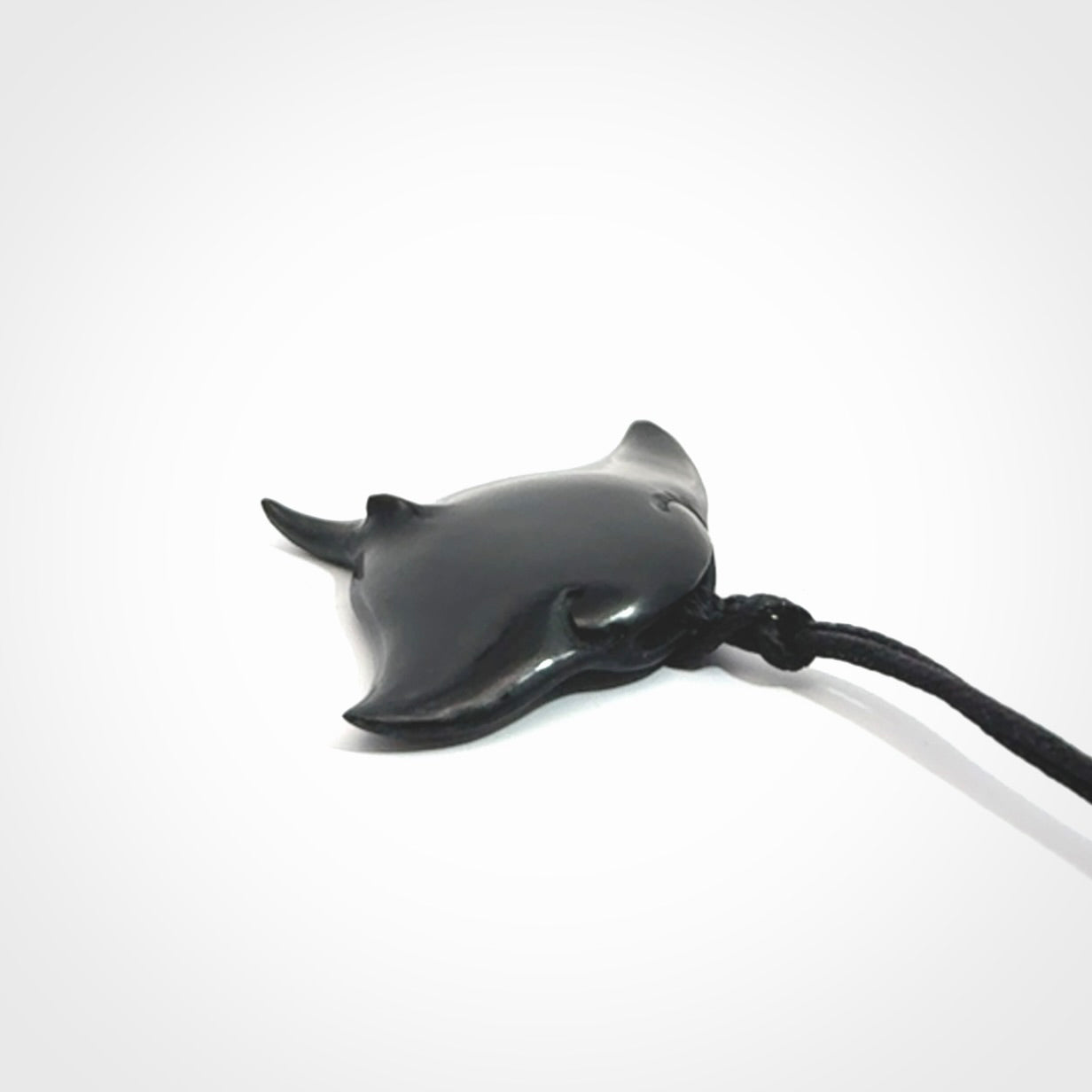Hand carved manta ray pendant. Black jade manta pendant hand carved by NZ Pacific. Black jade jewellery for sale online.