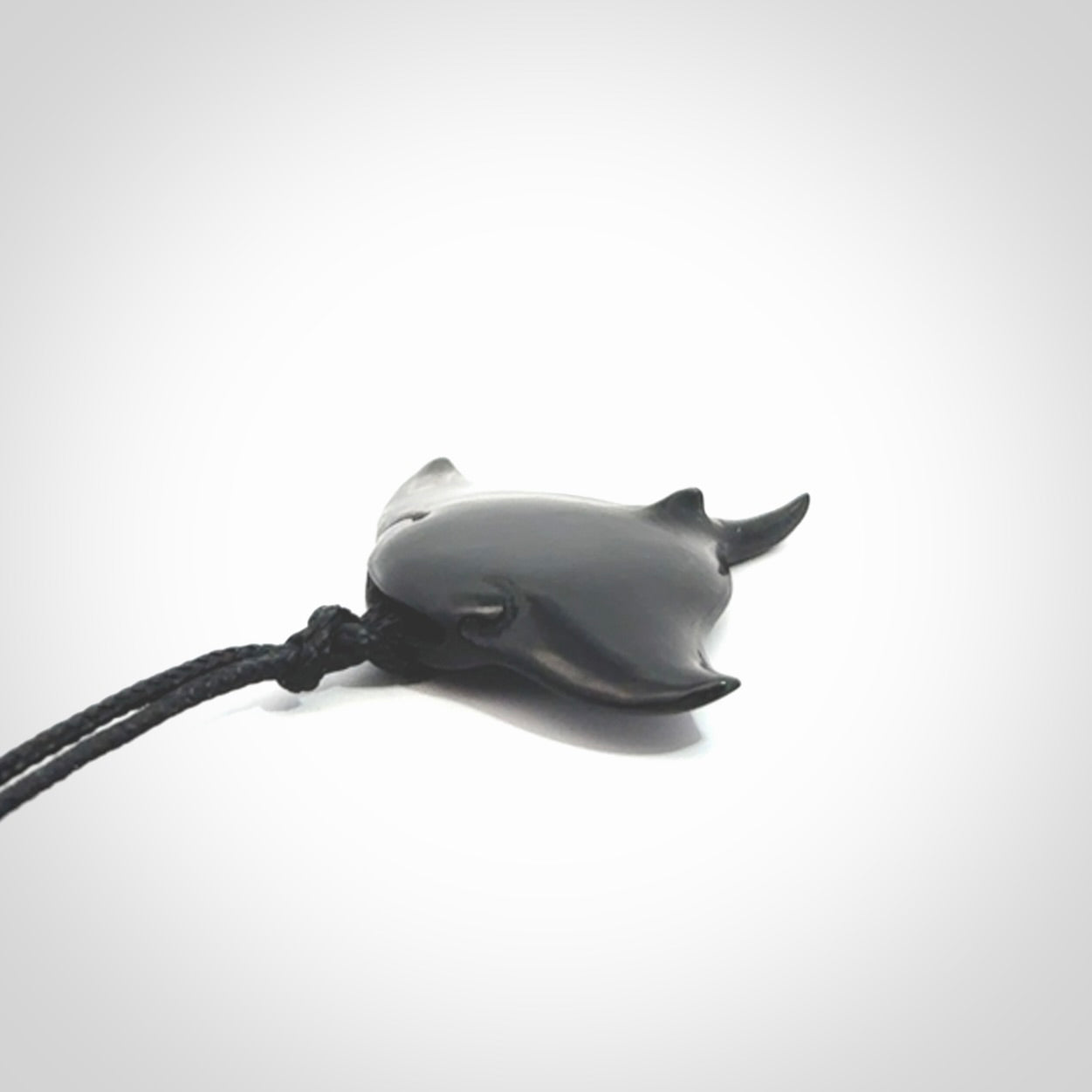 Hand carved manta ray pendant. Black jade manta pendant hand carved by NZ Pacific. Black jade jewellery for sale online.