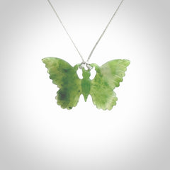 Large Butterfly design pendant carved in nephrite jade. Real jade jewellery for sale online with NZ Pacific. Large butterfly pendant hand made in Jade, provided with adjustable cord and packaged in a woven kete pouch.
