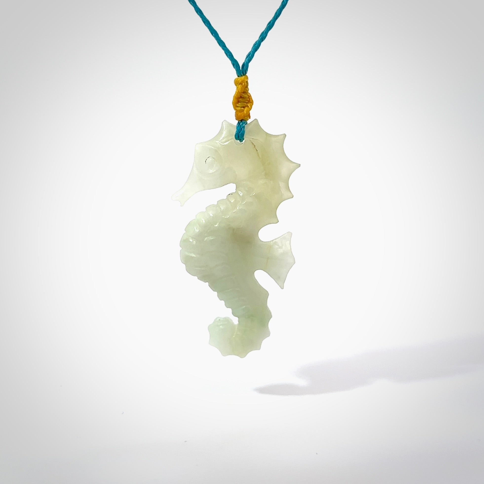 A hand carved Jadeite seahorse pendant. We have carved this from beautiful jadeite and we bind them with our hand-plaited cords. The cords are a waxed polyester so they are durable and strong. We ship these worldwide with express courier anywhere in the world.