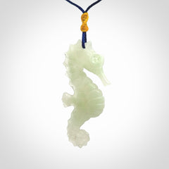 A hand carved Jadeite seahorse pendant. We have carved this from beautiful jadeite and we bind them with our Pacific Blue cords.