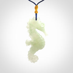 A hand carved Jadeite seahorse pendant. We have carved this from beautiful jadeite and we bind them with our Pacific Blue cords.