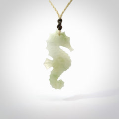 A hand carved Jadeite seahorse pendant. We have carved this from beautiful jadeite and we bind them with our hand-plaited cords. The cords are a waxed polyester so they are durable and strong. We ship these worldwide with express courier anywhere in the world.