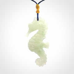 A hand carved Jadeite seahorse pendant. We have carved this from beautiful jadeite and we bind them with our Pacific Blue cords.