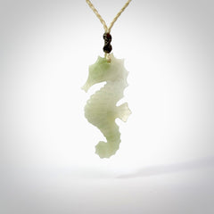 A hand carved Jadeite seahorse pendant. We have carved this from beautiful jadeite and we bind them with our hand-plaited cords. The cords are a waxed polyester so they are durable and strong. We ship these worldwide with express courier anywhere in the world.