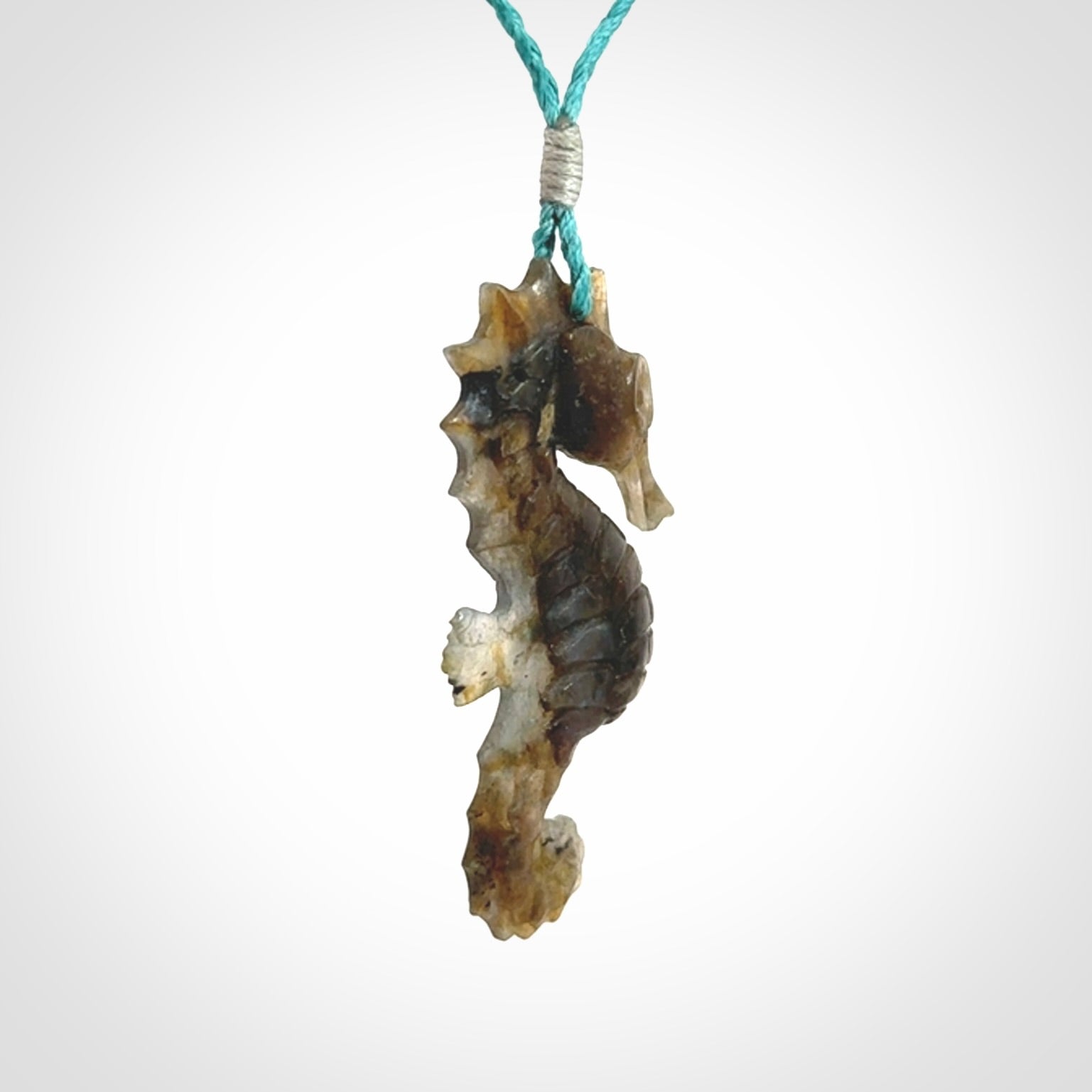 A hand carved labradorite seahorse pendant. We have carved this from beautiful labradorite and we bind them with our hand-plaited cords. The cords are a waxed polyester so they are durable and strong. We ship these worldwide with express courier anywhere in the world.