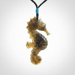 A hand carved labradorite seahorse pendant. We have carved this from beautiful labradorite and we bind them with our hand-plaited cords. The cords are a waxed polyester so they are durable and strong. We ship these worldwide with express courier anywhere in the world.