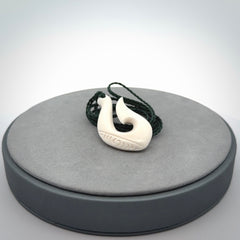 Hand carved bone hook pendants