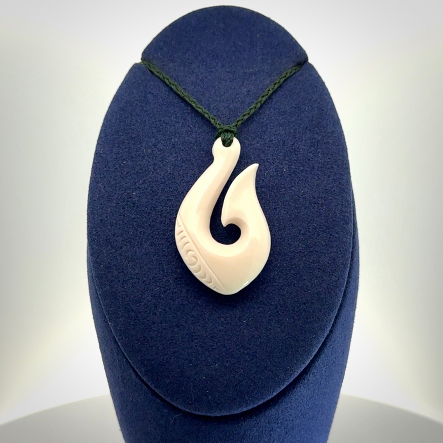 Hand carved bone hook pendants