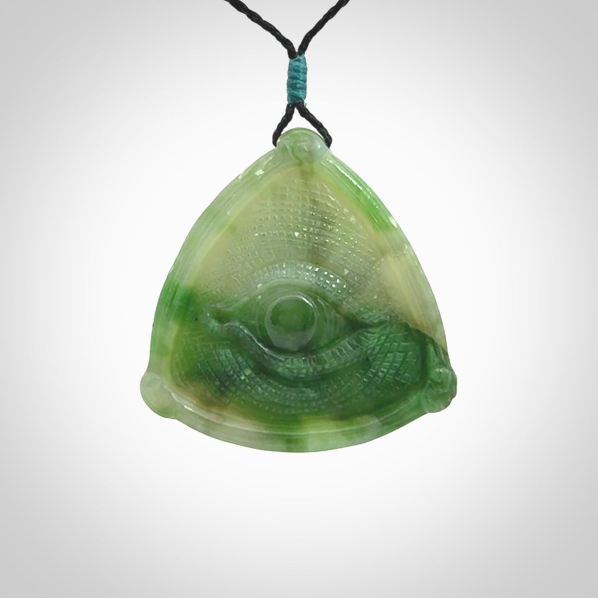 Hand carved contemporary jade third eye pendant. Authentic jade jewellery for sale online. Third eye Jade necklace with adjustable cord.