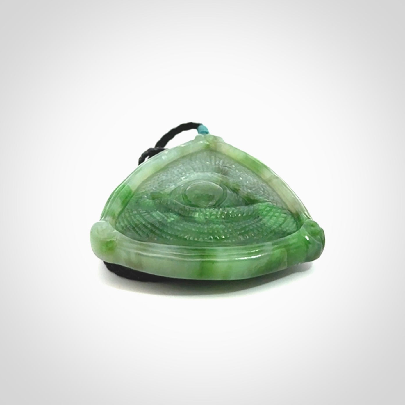 Hand carved contemporary jade third eye pendant. Authentic jade jewellery for sale online. Third eye Jade necklace with adjustable cord.