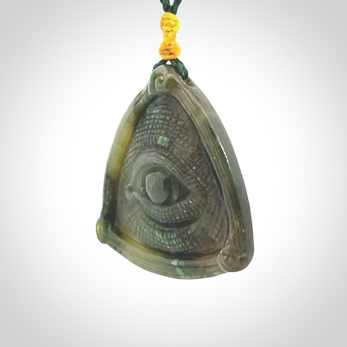Hand carved contemporary jade third eye pendant. Authentic jade jewellery for sale online. Third eye Jade necklace with adjustable cord.