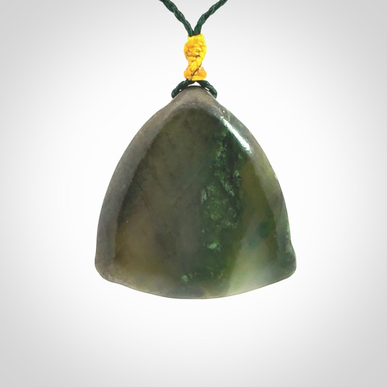 Hand carved contemporary jade third eye pendant. Authentic jade jewellery for sale online. Third eye Jade necklace with adjustable cord.