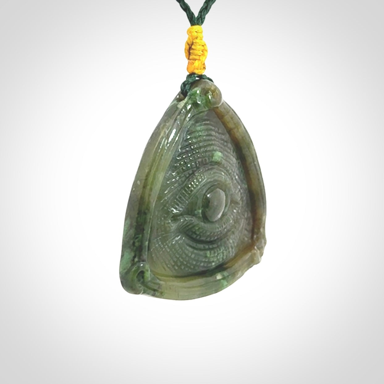 Hand carved contemporary jade third eye pendant. Authentic jade jewellery for sale online. Third eye Jade necklace with adjustable cord.