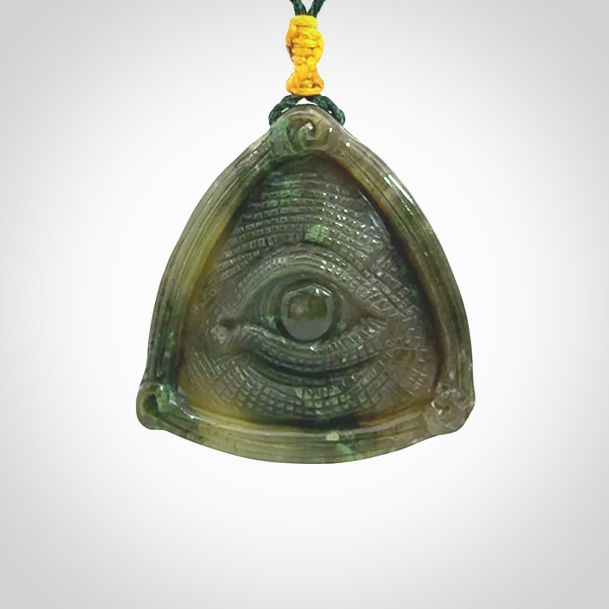 Hand carved contemporary jade third eye pendant. Authentic jade jewellery for sale online. Third eye Jade necklace with adjustable cord.