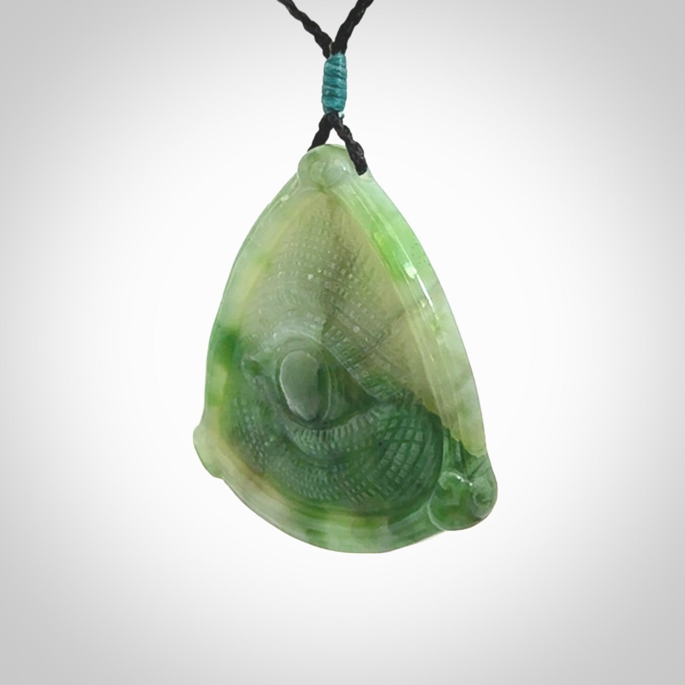 Hand carved contemporary jade third eye pendant. Authentic jade jewellery for sale online. Third eye Jade necklace with adjustable cord.