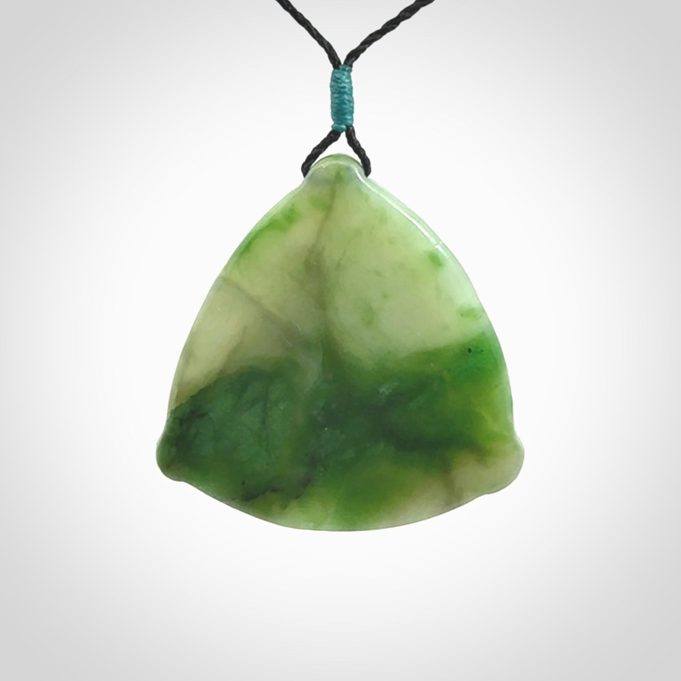 Hand carved contemporary jade third eye pendant. Authentic jade jewellery for sale online. Third eye Jade necklace with adjustable cord.