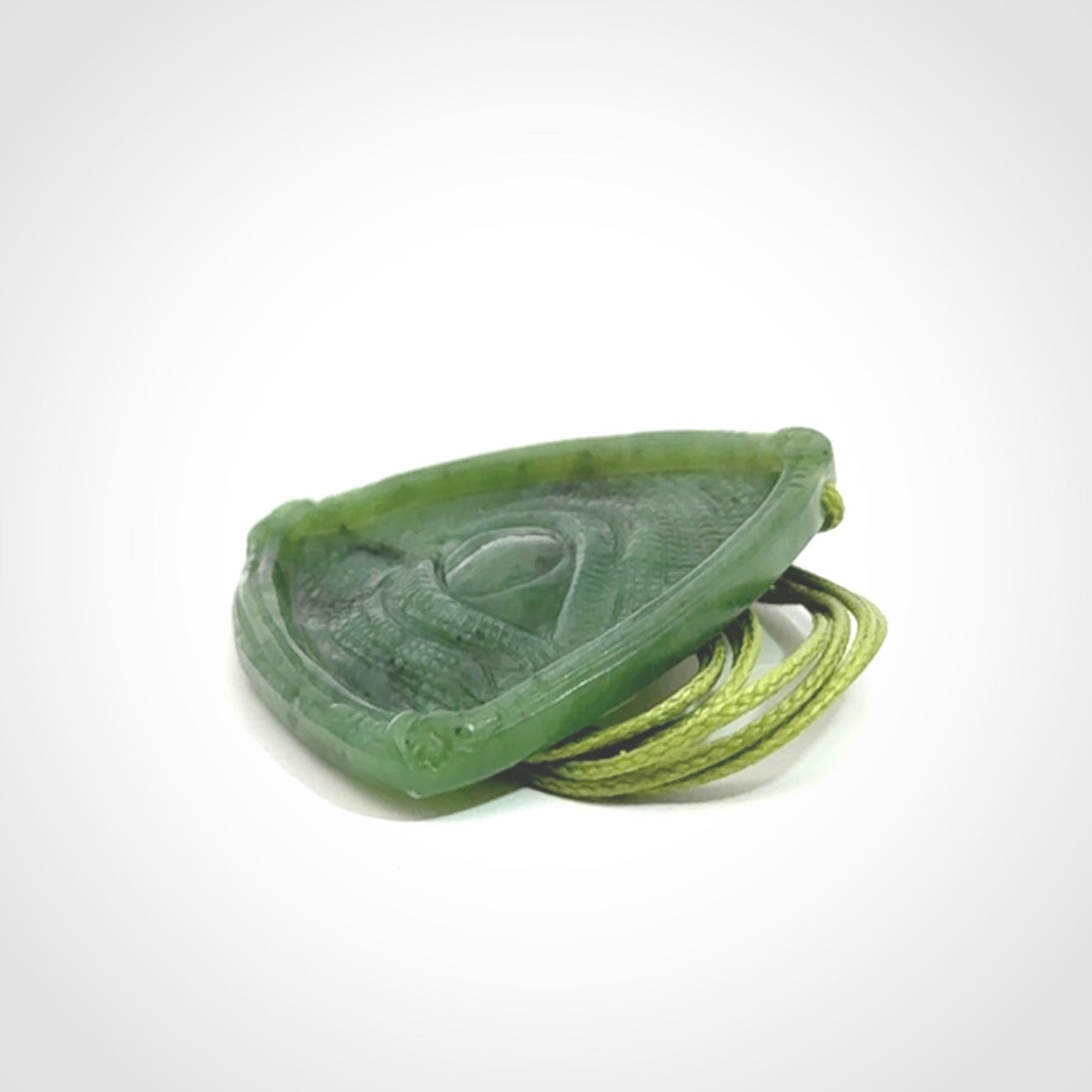 Hand carved contemporary jade third eye pendant. Authentic jade jewellery for sale online. Third eye Jade necklace with adjustable cord.
