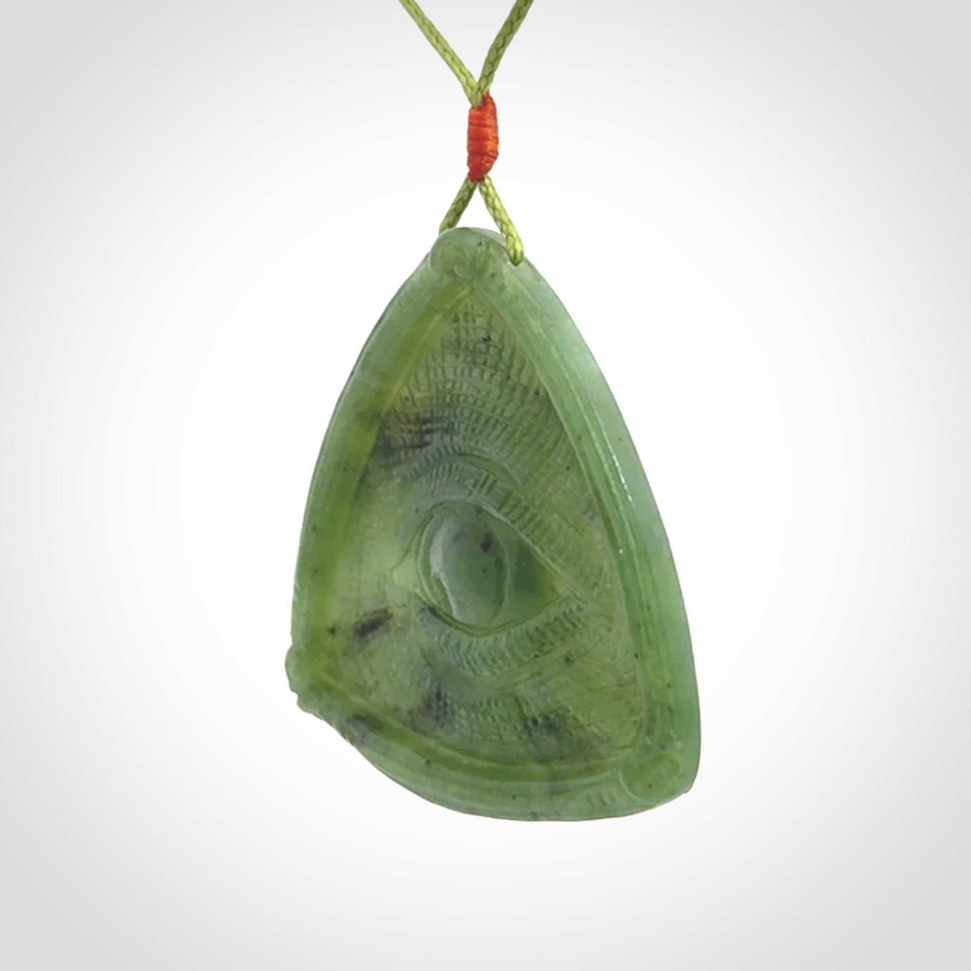 Hand carved contemporary jade third eye pendant. Authentic jade jewellery for sale online. Third eye Jade necklace with adjustable cord.