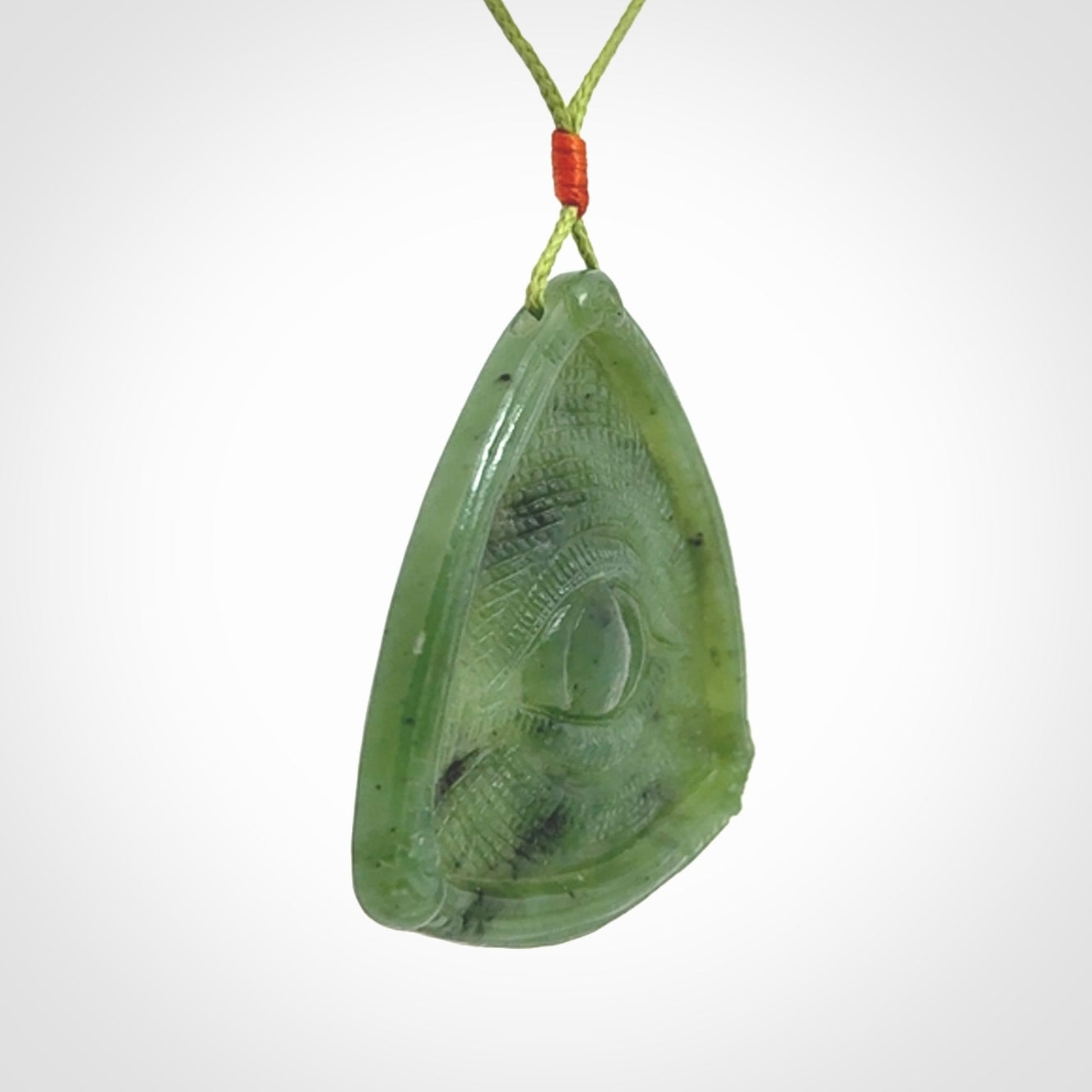 Hand carved contemporary jade third eye pendant. Authentic jade jewellery for sale online. Third eye Jade necklace with adjustable cord.