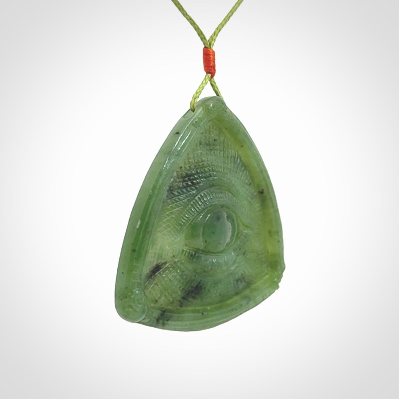 Hand carved contemporary jade third eye pendant. Authentic jade jewellery for sale online. Third eye Jade necklace with adjustable cord.
