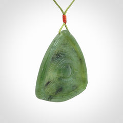 Hand carved contemporary jade third eye pendant. Authentic jade jewellery for sale online. Third eye Jade necklace with adjustable cord.