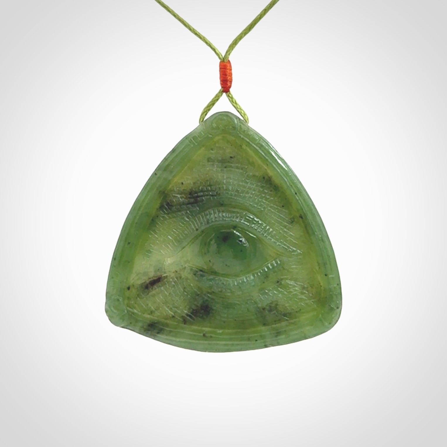 Hand carved contemporary jade third eye pendant. Authentic jade jewellery for sale online. Third eye Jade necklace with adjustable cord.