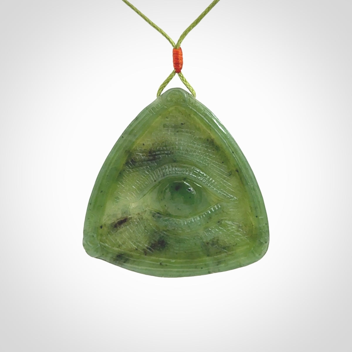 Hand carved contemporary jade third eye pendant. Authentic jade jewellery for sale online. Third eye Jade necklace with adjustable cord.
