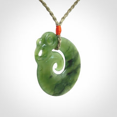 New Zealand Jade Koru Manaia. Hand carved Koropepe pendant. Made in New Zealand. Real Jade, pounamu. Real New Zealand Jade Manaia with Koru necklace with a polished finish.