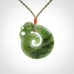 New Zealand Jade Koru Manaia. Hand carved Koropepe pendant. Made in New Zealand. Real Jade, pounamu. Real New Zealand Jade Manaia with Koru necklace with a polished finish.