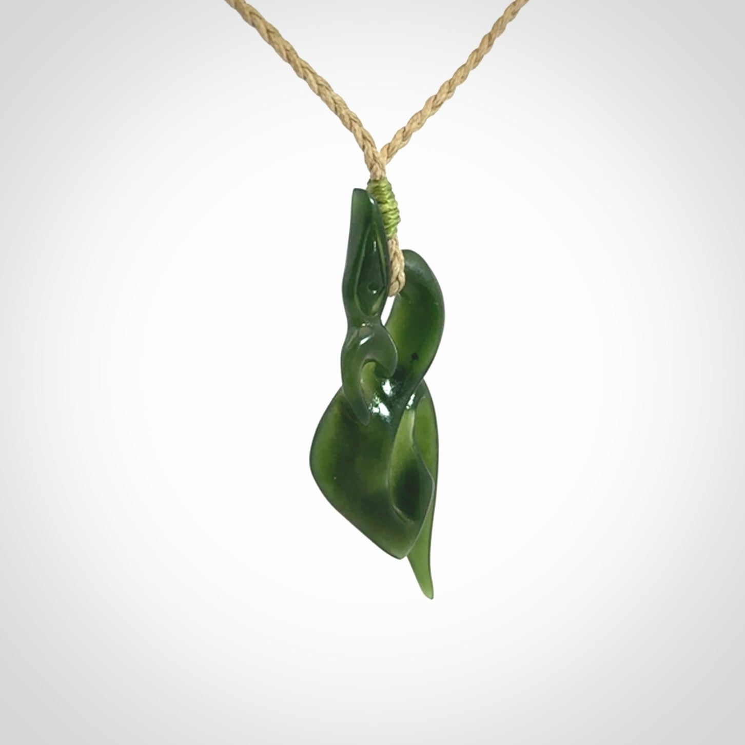 A Gorgeous Dark Green Jade Manaia Pendant