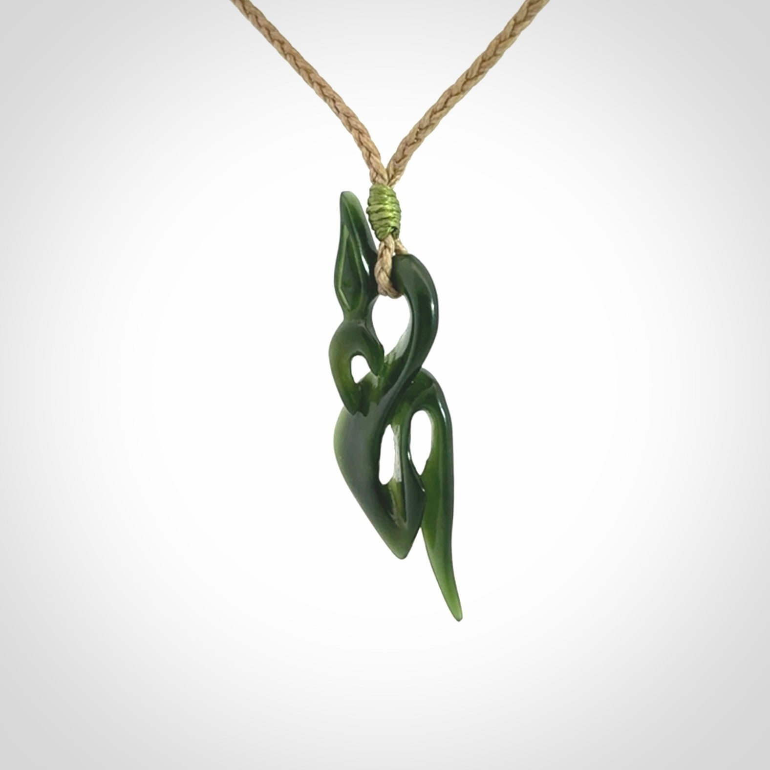 A Gorgeous Dark Green Jade Manaia Pendant