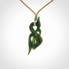 A Gorgeous Dark Green Jade Manaia Pendant
