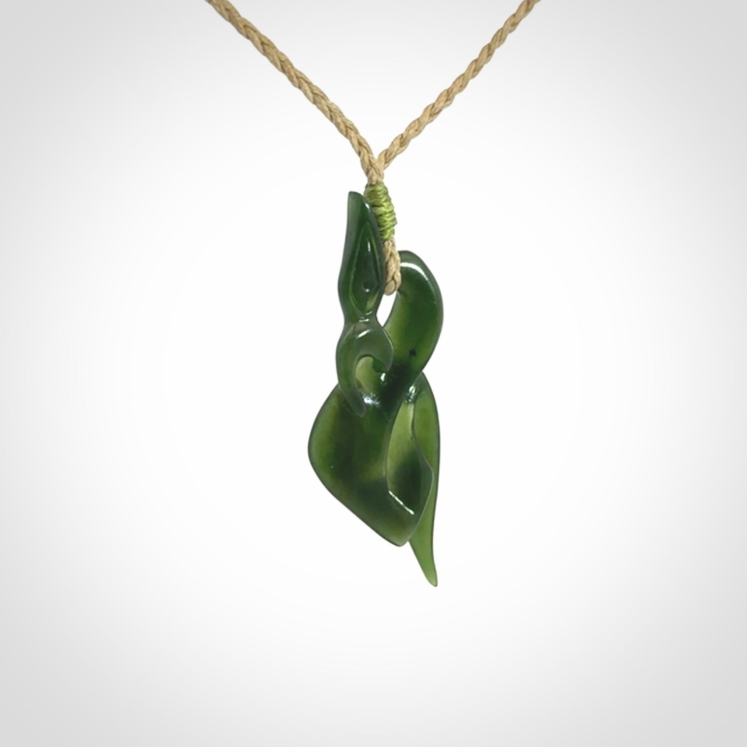 A Gorgeous Dark Green Jade Manaia Pendant