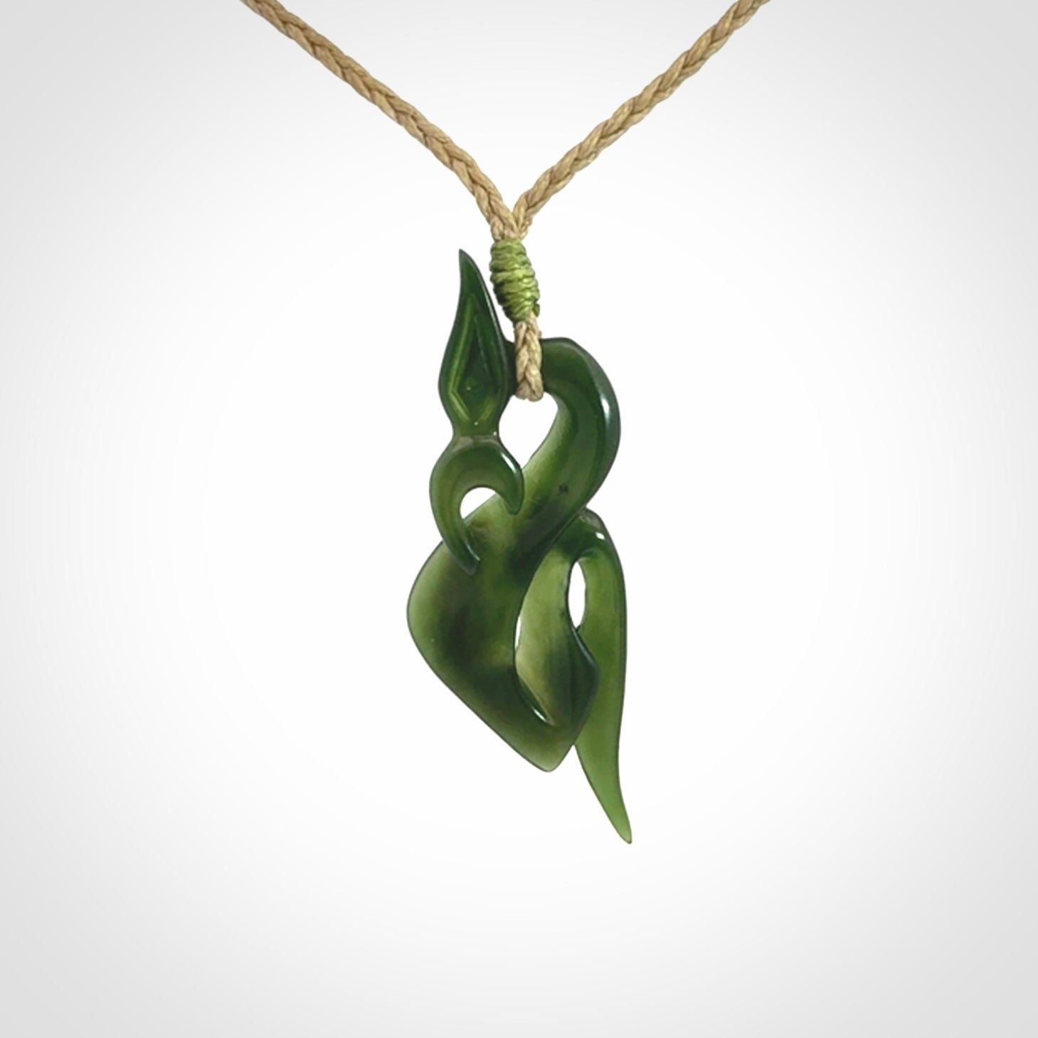 A Gorgeous Dark Green Jade Manaia Pendant