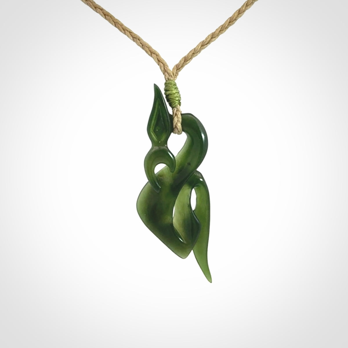 A Gorgeous Dark Green Jade Manaia Pendant
