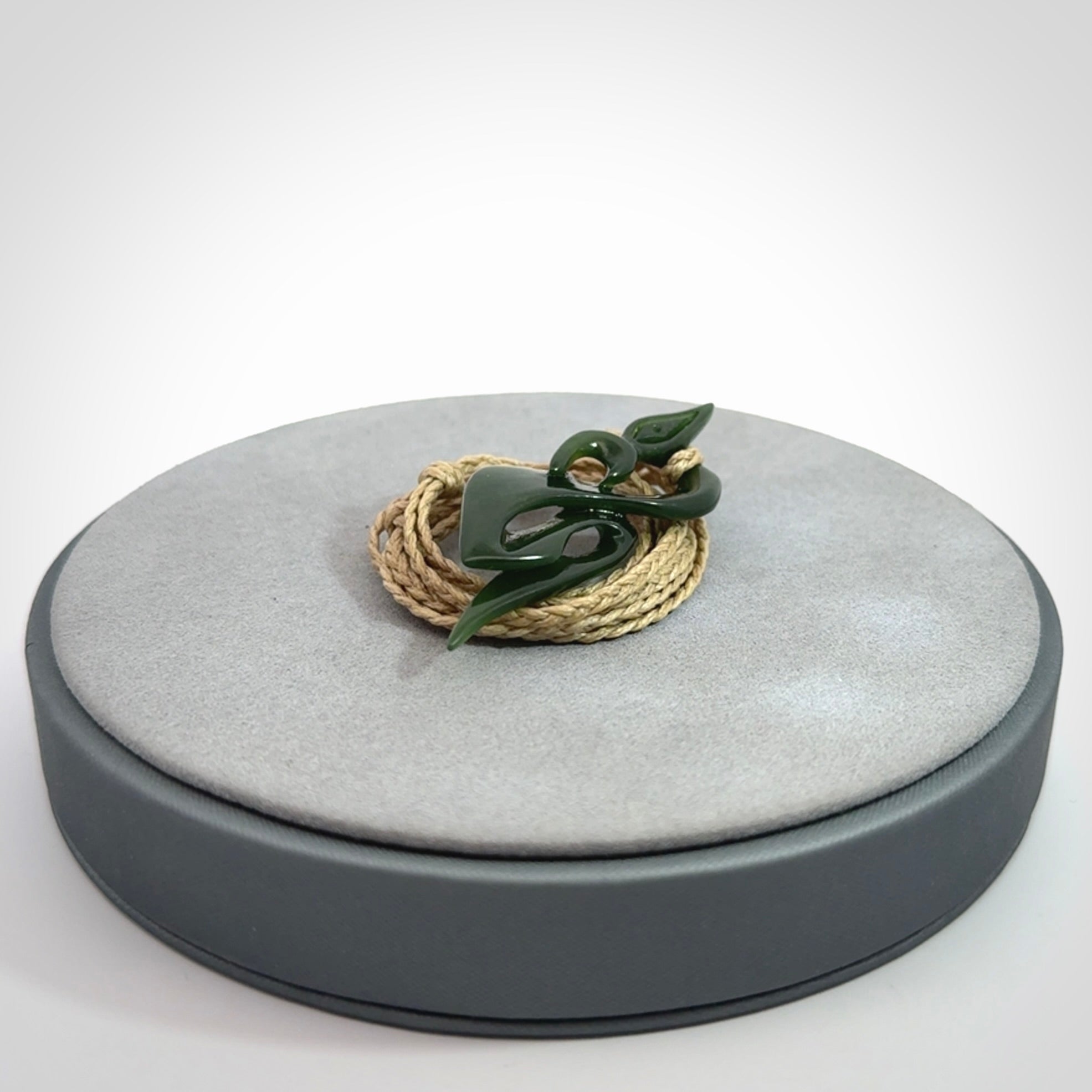 A Gorgeous Dark Green Jade Manaia Pendant