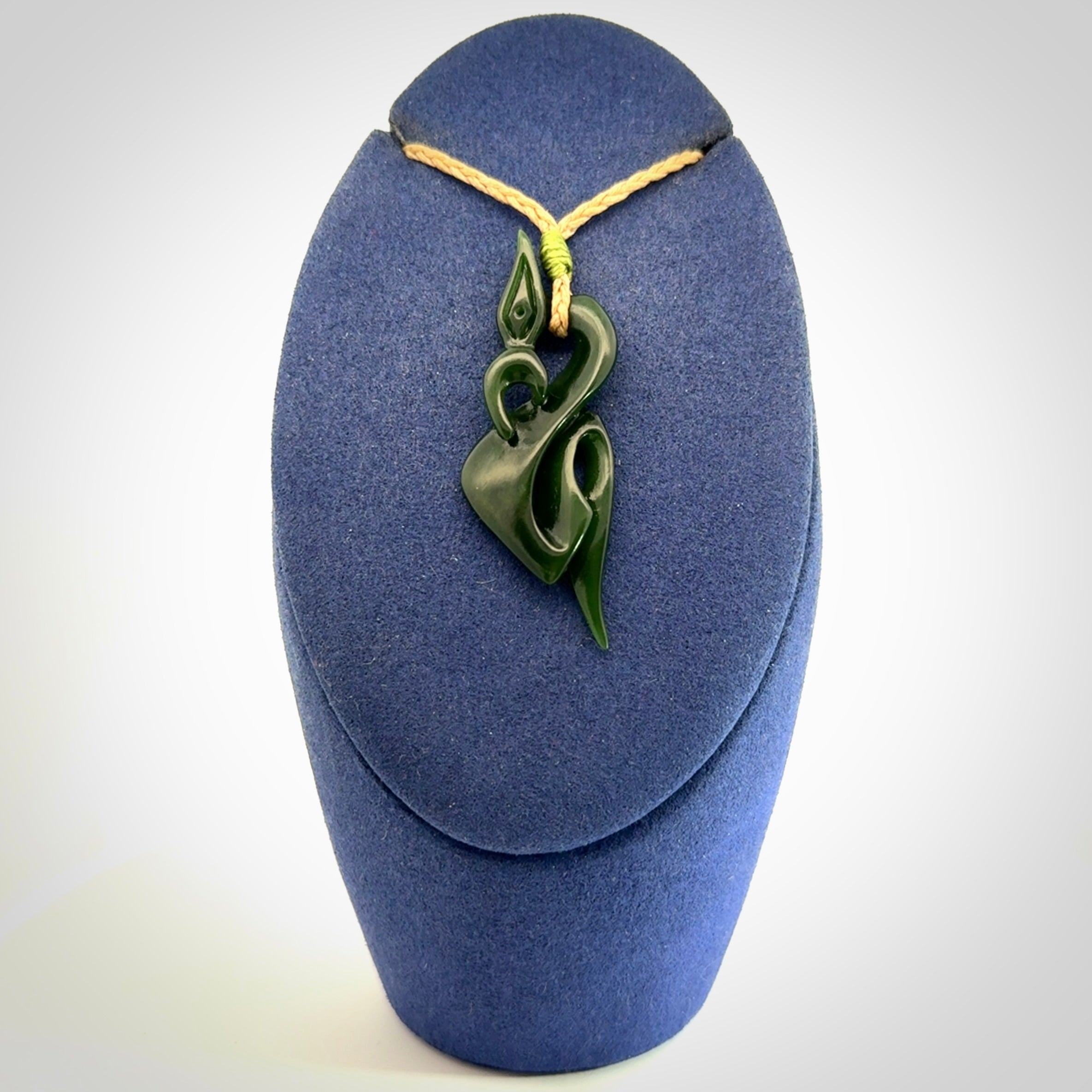 A Gorgeous Dark Green Jade Manaia Pendant