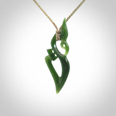 A beautiful hand carved New Zealand Jade Manaia pendant with adjustable cord.