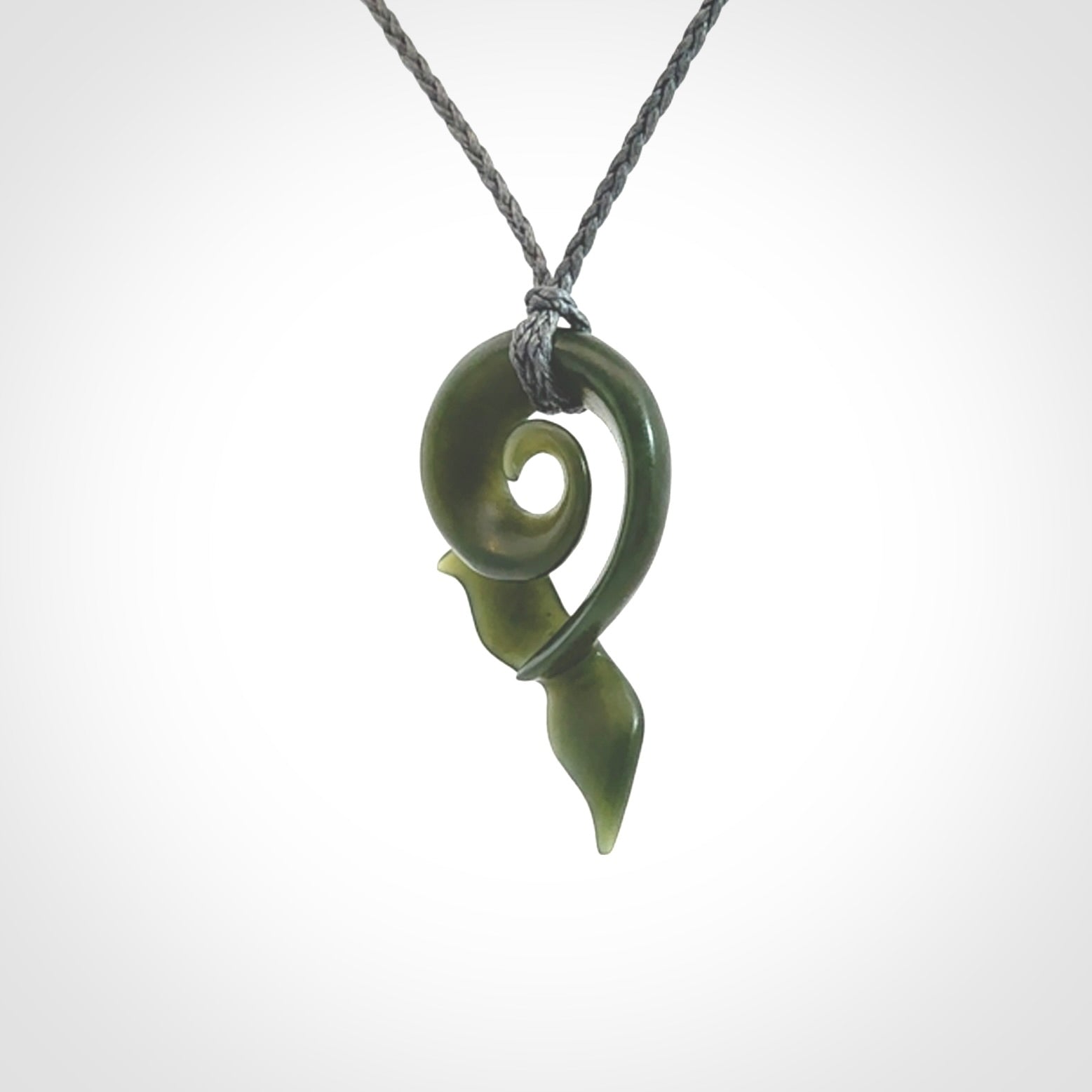 Hand carved New Zealand Jade whale tail koru pendant