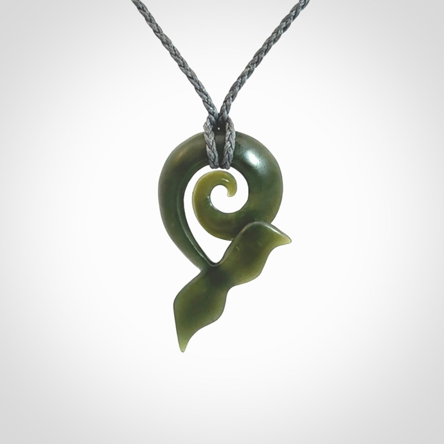 Hand carved New Zealand Jade whale tail koru pendant