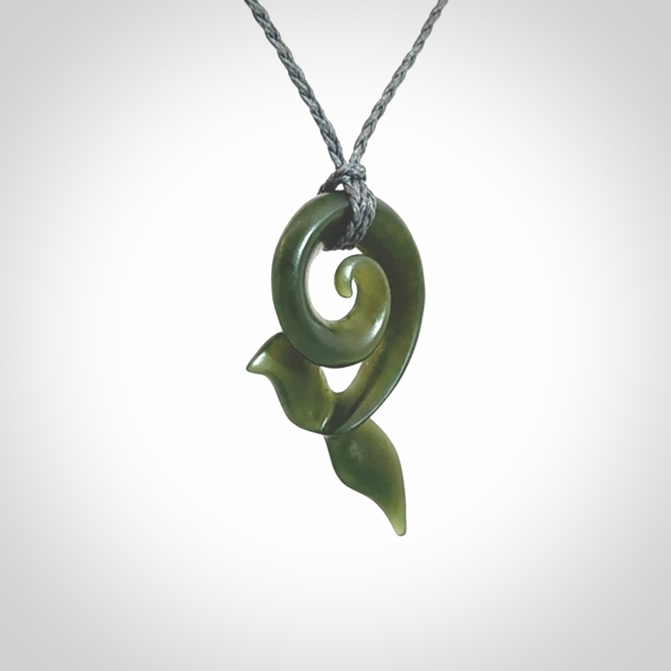 Hand carved New Zealand Jade whale tail koru pendant