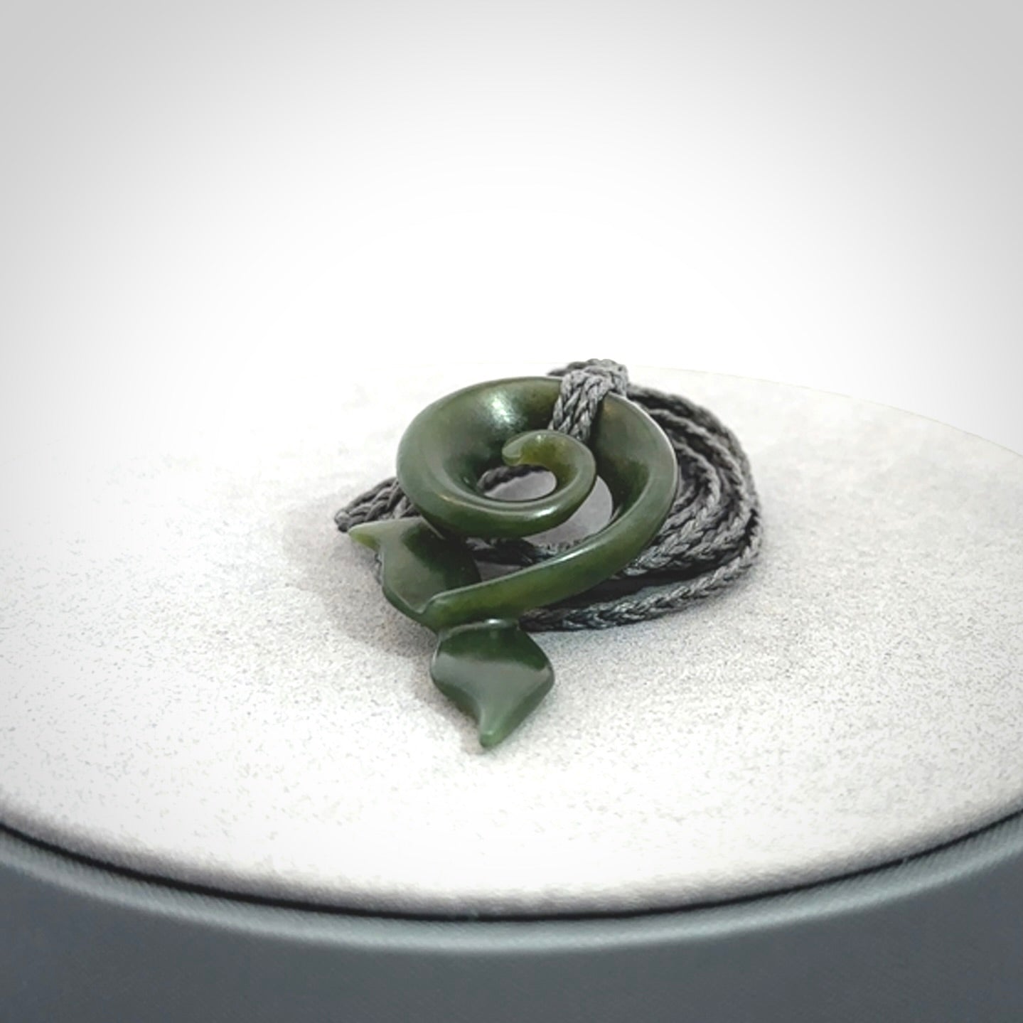Hand carved New Zealand Jade whale tail koru pendant