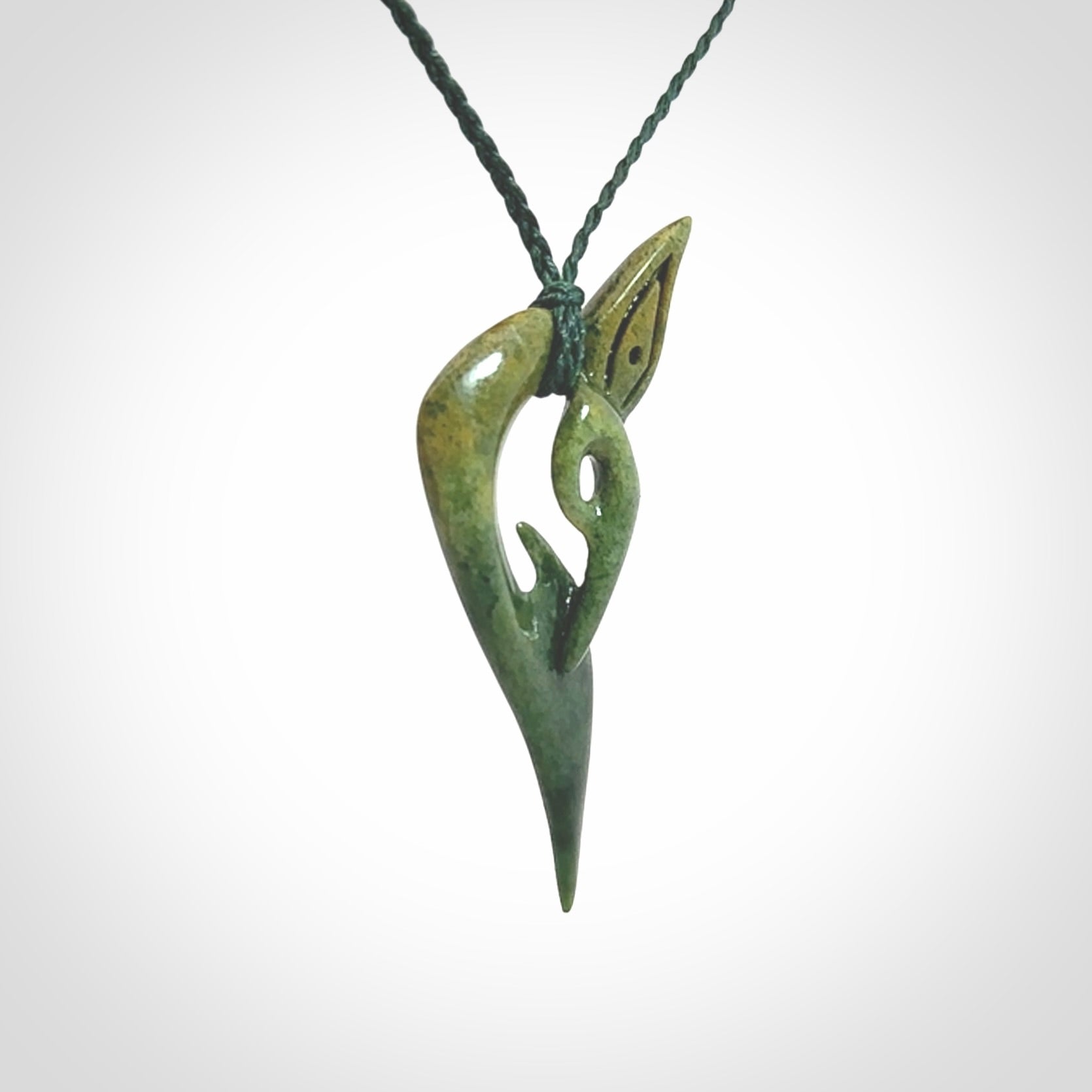 A Very Cool, Unique, Manaia Pendant, Carved in Flower Jade.