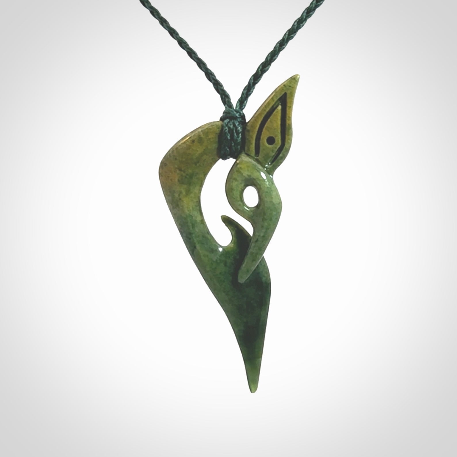 A Very Cool, Unique, Manaia Pendant, Carved in Flower Jade.